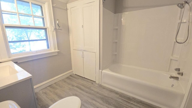 5415 N 36th St, Milwaukee, WI 53209 - bathroom with wood finished floors, toilet, shower / bath combination, vanity, and baseboards