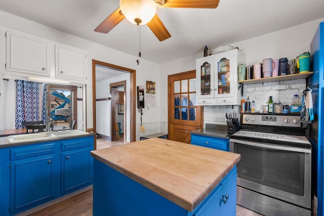 1439 Parkview Dr, Kewaskum, WI 53040 - kitchen featuring stainless steel range with electric cooktop, blue cabinetry, and white cabinets