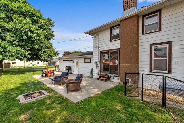 1439 Parkview Dr, Kewaskum, WI 53040 - back of property with entry steps, a patio area, an outdoor fire pit, and a chimney