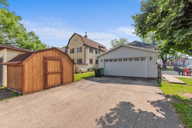 1439 Parkview Dr, Kewaskum, WI 53040 - view of side of home with a garage