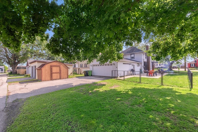1439 Parkview Dr, Kewaskum, WI 53040 - view of yard with asphalt driveway and a garage