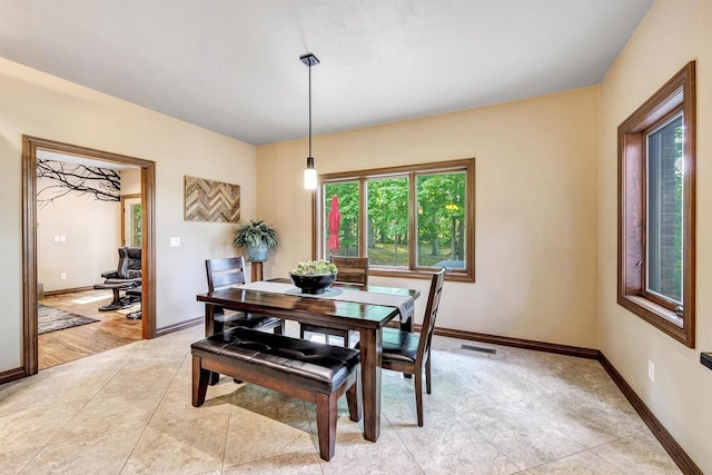 1830 Pine Tree Ct, Luxemburg, WI 54217 - dining room featuring baseboards and light tile patterned flooring