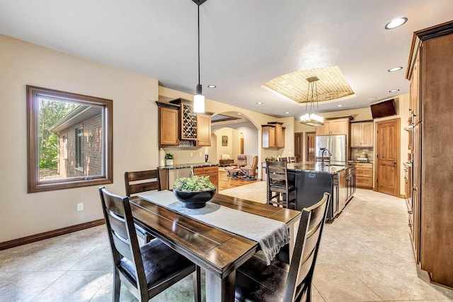 1830 Pine Tree Ct, Luxemburg, WI 54217 - dining room featuring arched walkways, light tile patterned flooring, baseboards, and recessed lighting