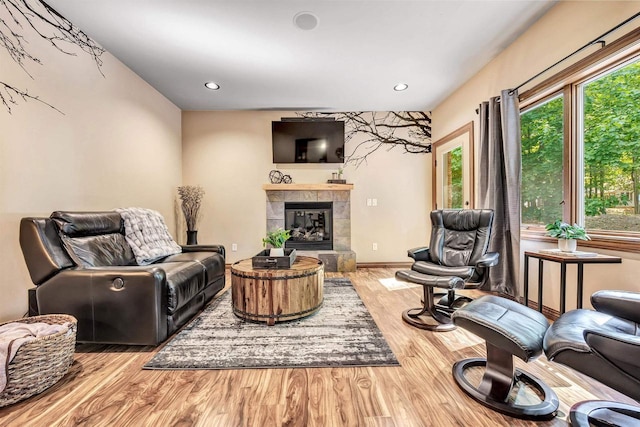 1830 Pine Tree Ct, Luxemburg, WI 54217 - living area featuring wood finished floors, a fireplace, and recessed lighting