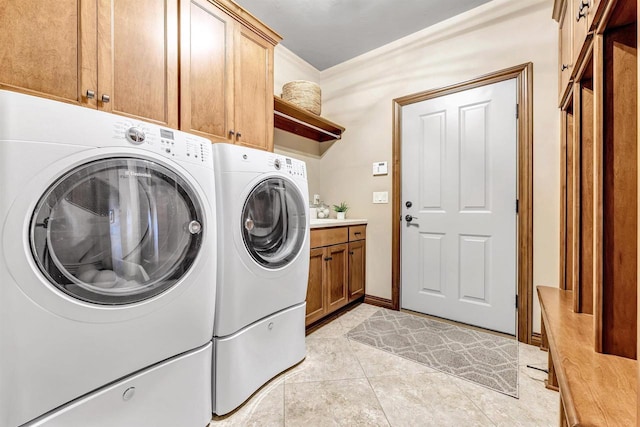1830 Pine Tree Ct, Luxemburg, WI 54217 - laundry area with washing machine and dryer, cabinet space, and light tile patterned floors