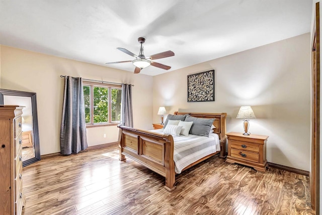 1830 Pine Tree Ct, Luxemburg, WI 54217 - bedroom featuring wood finished floors, baseboards, and ceiling fan
