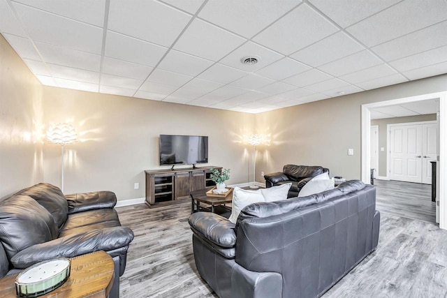 1830 Pine Tree Ct, Luxemburg, WI 54217 - living area featuring wood finished floors, baseboards, and a drop ceiling