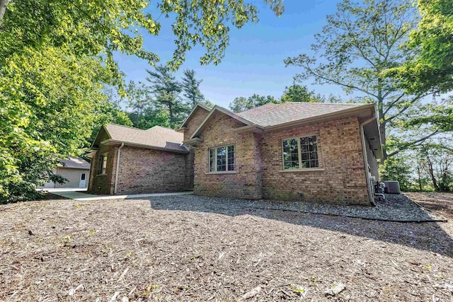 1830 Pine Tree Ct, Luxemburg, WI 54217 - single story home with brick siding, central air condition unit, and roof with shingles