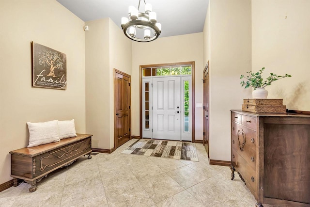 1830 Pine Tree Ct, Luxemburg, WI 54217 - entryway with a chandelier, baseboards, and a towering ceiling