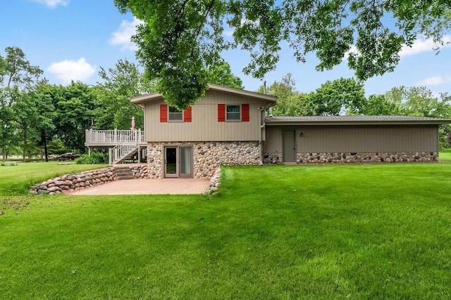 N9570 Sunset Dr, East Troy, WI 53120 - back of house featuring a patio area, a deck, stone siding, a yard, and stairs