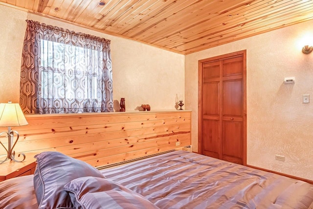 N9570 Sunset Dr, East Troy, WI 53120 - bedroom with a textured wall, wooden ceiling, and crown molding