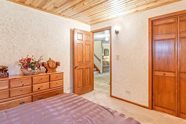N9570 Sunset Dr, East Troy, WI 53120 - bedroom with a textured wall, light carpet, ornamental molding, wood ceiling, and a closet