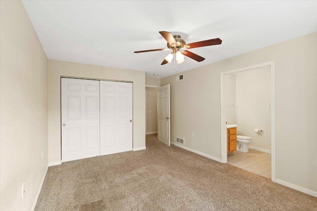 5118 Walbridge Ave, Madison, WI 53714 - unfurnished bedroom with light colored carpet, a closet, a ceiling fan, and ensuite bath