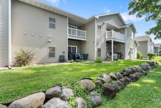 5118 Walbridge Ave, Madison, WI 53714 - back of house with a balcony, a yard, and a patio area