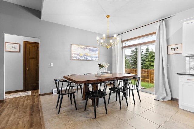 4835 W Jack Pine Ct, Appleton, WI 54913 - dining space featuring a chandelier, baseboards, and light tile patterned floors