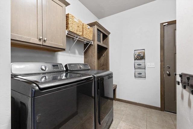 4835 W Jack Pine Ct, Appleton, WI 54913 - laundry area with washing machine and dryer, cabinet space, light tile patterned floors, and baseboards