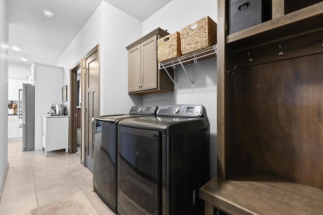4835 W Jack Pine Ct, Appleton, WI 54913 - washroom featuring separate washer and dryer, cabinet space, and light tile patterned flooring