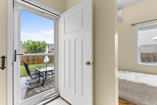 4835 W Jack Pine Ct, Appleton, WI 54913 - doorway to outside featuring healthy amount of natural light and an AC wall unit