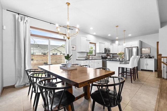 4835 W Jack Pine Ct, Appleton, WI 54913 - dining space with a chandelier, recessed lighting, light tile patterned flooring, and baseboards