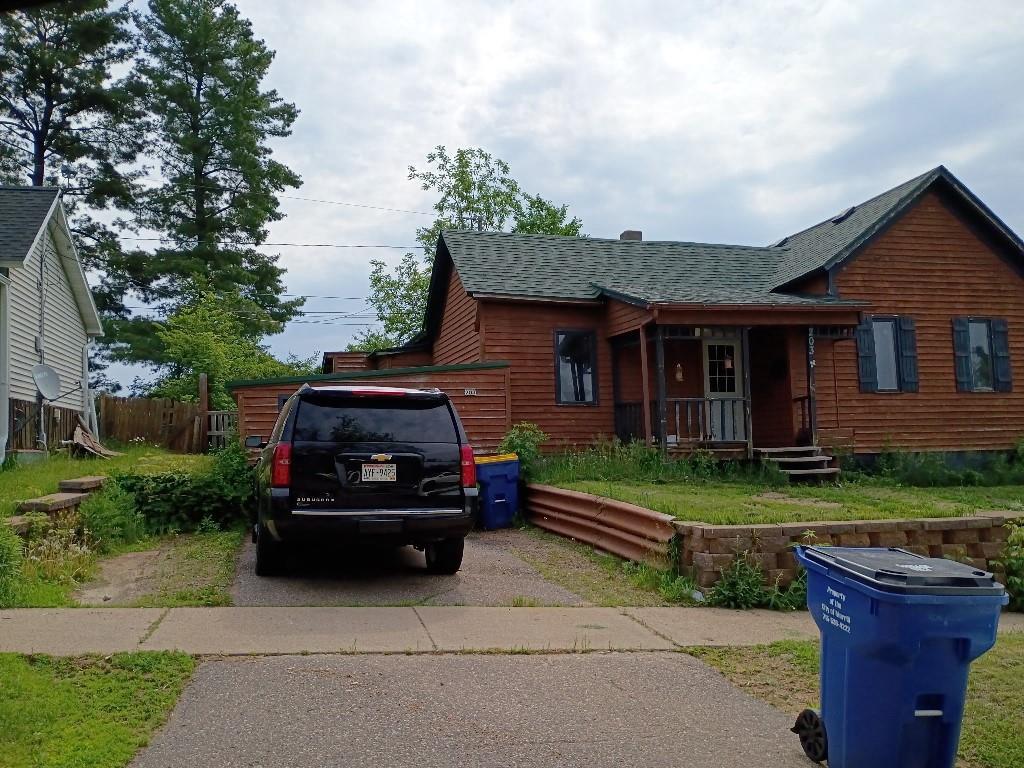 203 E St, Merrill, WI 54452 - view of front of home featuring a shingled roof