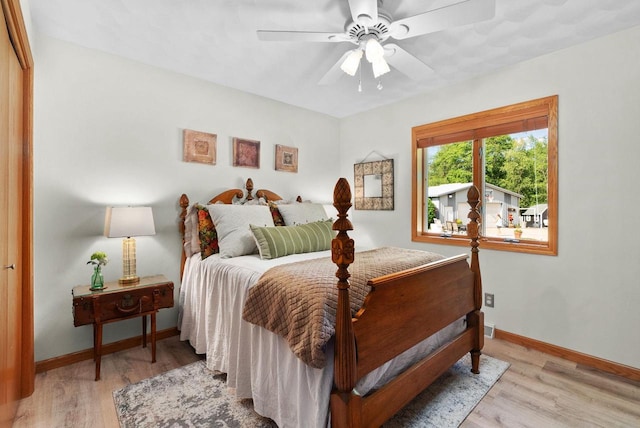 N2068 Alphorn Rd, Monroe, WI 53566 - bedroom featuring light wood-style flooring and a ceiling fan
