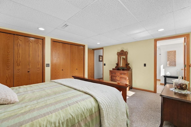N2068 Alphorn Rd, Monroe, WI 53566 - bedroom featuring multiple closets, light colored carpet, a drop ceiling, and recessed lighting