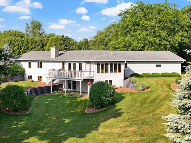 N2068 Alphorn Rd, Monroe, WI 53566 - back of property with stairway, a wooden deck, a chimney, and a lawn