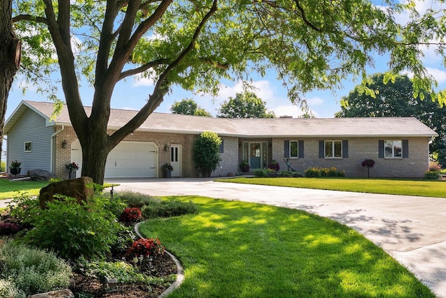 N2068 Alphorn Rd, Monroe, WI 53566 - single story home featuring concrete driveway, brick siding, an attached garage, and a front lawn