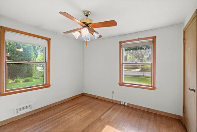 600 Lombard Ave, Racine, WI 53402 - spare room featuring healthy amount of natural light, baseboards, light wood-style floors, and a ceiling fan