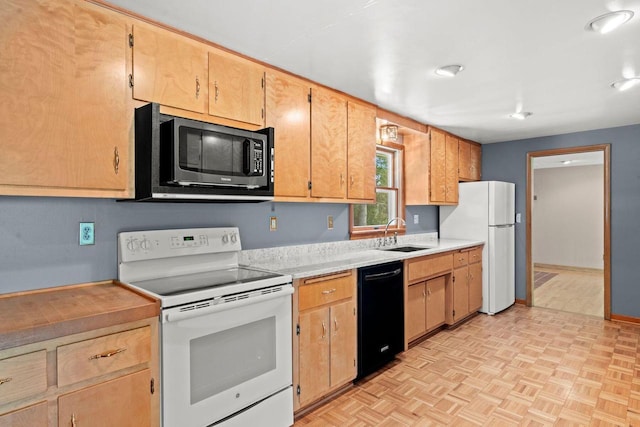 600 Lombard Ave, Racine, WI 53402 - kitchen with white appliances, a sink, light countertops, and baseboards