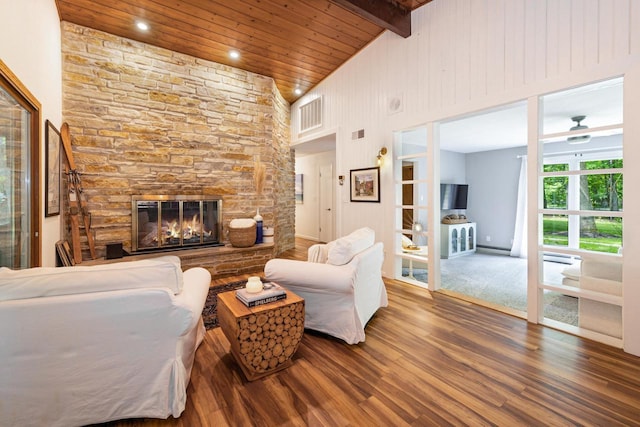 1418 Mill Rd, Delafield, WI 53018 - living area with wood finished floors, a stone fireplace, high vaulted ceiling, wooden ceiling with exposed beams, and recessed lighting