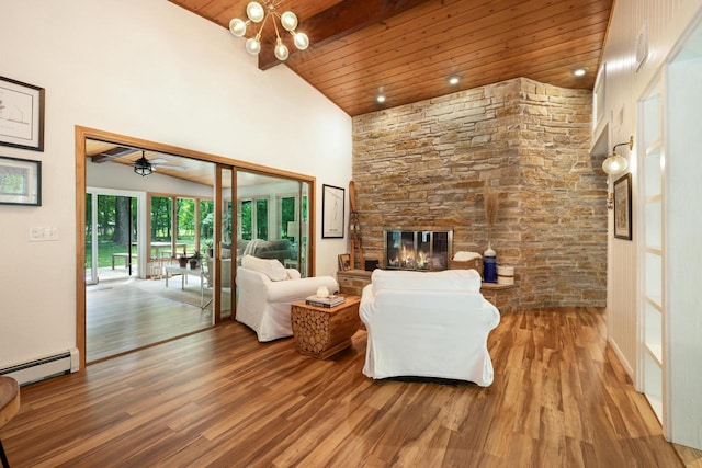 1418 Mill Rd, Delafield, WI 53018 - living room with wooden ceiling, a baseboard heating unit, wood finished floors, high vaulted ceiling, and a stone fireplace