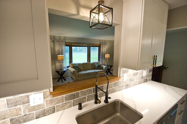11426 W Woods Rd, Franklin, WI 53132 - kitchen with a sink, tasteful backsplash, and dishwashing machine