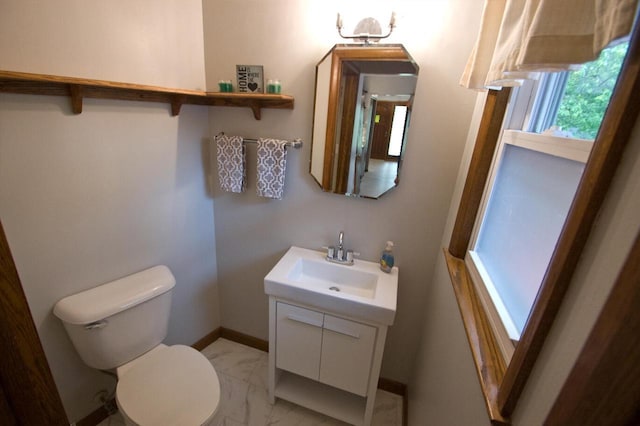 11426 W Woods Rd, Franklin, WI 53132 - half bath with vanity, toilet, marble finish floors, and baseboards