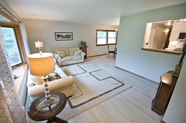 11426 W Woods Rd, Franklin, WI 53132 - living area featuring light wood-type flooring and baseboards