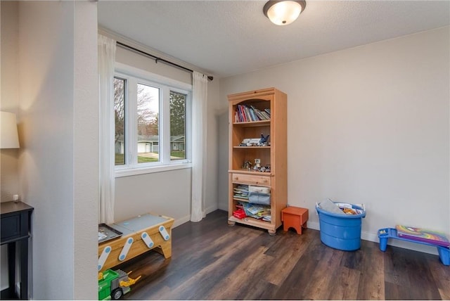 222 1st Ave, Clear Lake, WI 54005 - recreation room with dark wood finished floors and baseboards
