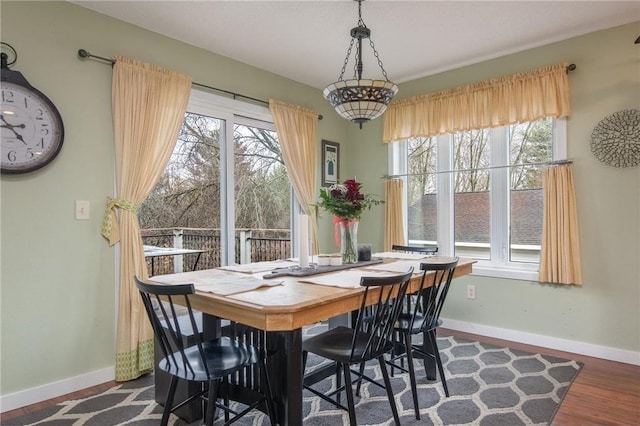 222 1st Ave, Clear Lake, WI 54005 - dining space featuring plenty of natural light, baseboards, and dark wood finished floors