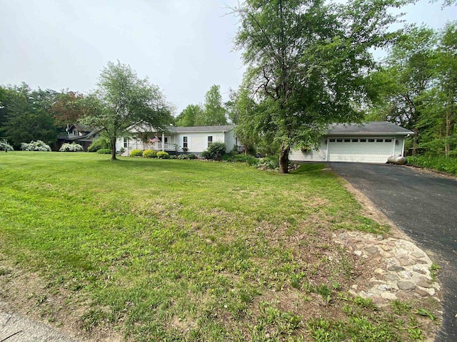 8001 Waschbisch Rd, Oconto Falls, WI 54154 - view of front of property with driveway, a front lawn, and an attached garage