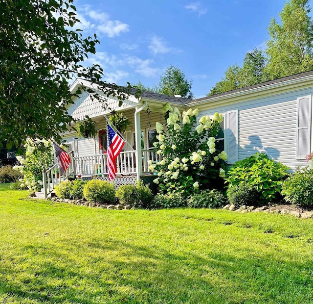 8001 Waschbisch Rd, Oconto Falls, WI 54154 - view of front of property with a porch and a front lawn