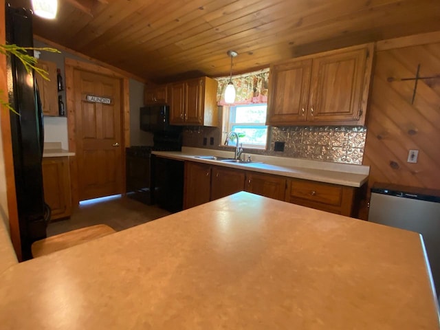 8001 Waschbisch Rd, Oconto Falls, WI 54154 - kitchen with a sink, black range oven, vaulted ceiling, light countertops, and brown cabinets
