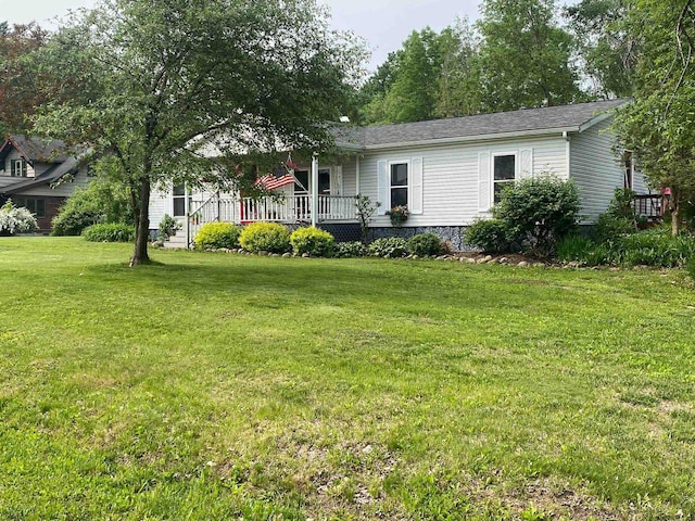 8001 Waschbisch Rd, Oconto Falls, WI 54154 - view of front of house with covered porch and a front yard