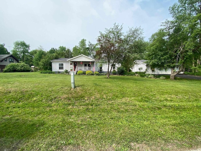 8001 Waschbisch Rd, Oconto Falls, WI 54154 - view of green lawn featuring covered porch