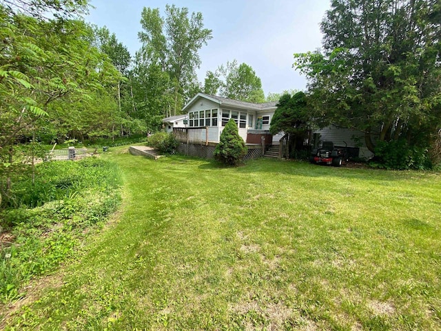 8001 Waschbisch Rd, Oconto Falls, WI 54154 - view of grassy yard with a wooden deck