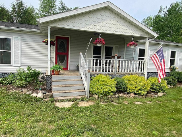 8001 Waschbisch Rd, Oconto Falls, WI 54154 - view of front of home featuring a porch and a front lawn
