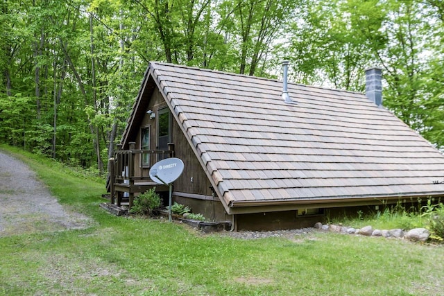 16651 Dolittle Ln, Townsend, WI 54175 - view of property exterior featuring a chimney and a yard