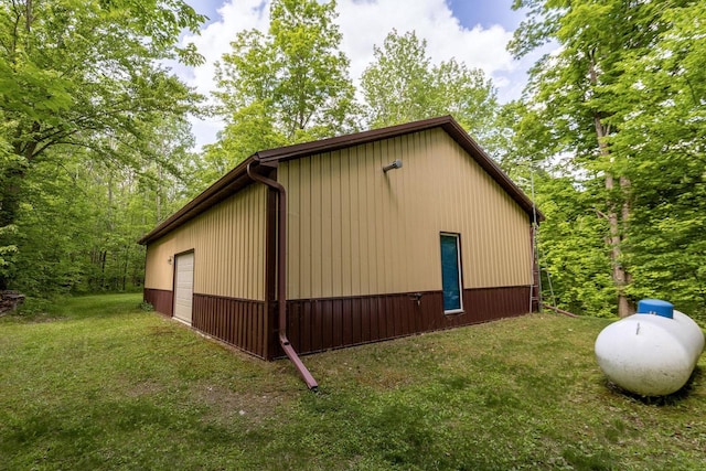 16651 Dolittle Ln, Townsend, WI 54175 - view of side of home featuring a detached garage and a lawn