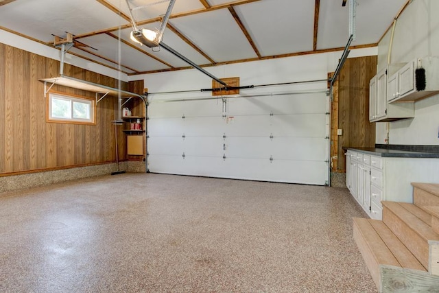 N5071 Deer Trl, Marinette, WI 54143 - garage featuring wooden walls and a garage door opener