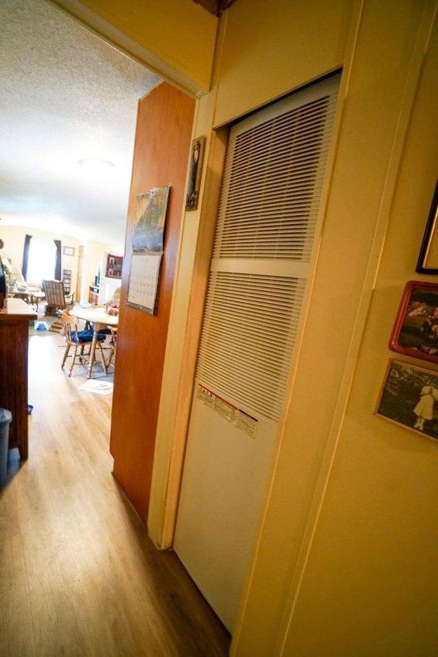 134 Attewell St Unit 54, Mauston, WI 53948 - hall featuring light wood-type flooring and a heating unit