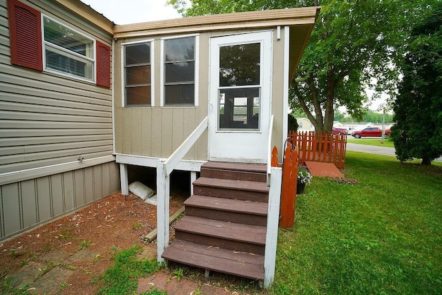 134 Attewell St Unit 54, Mauston, WI 53948 - doorway to property with a yard