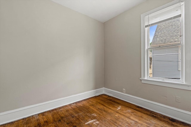 1718 W Washington St Unit 1720, Milwaukee, WI 53204 - unfurnished room with baseboards and dark wood-style flooring
